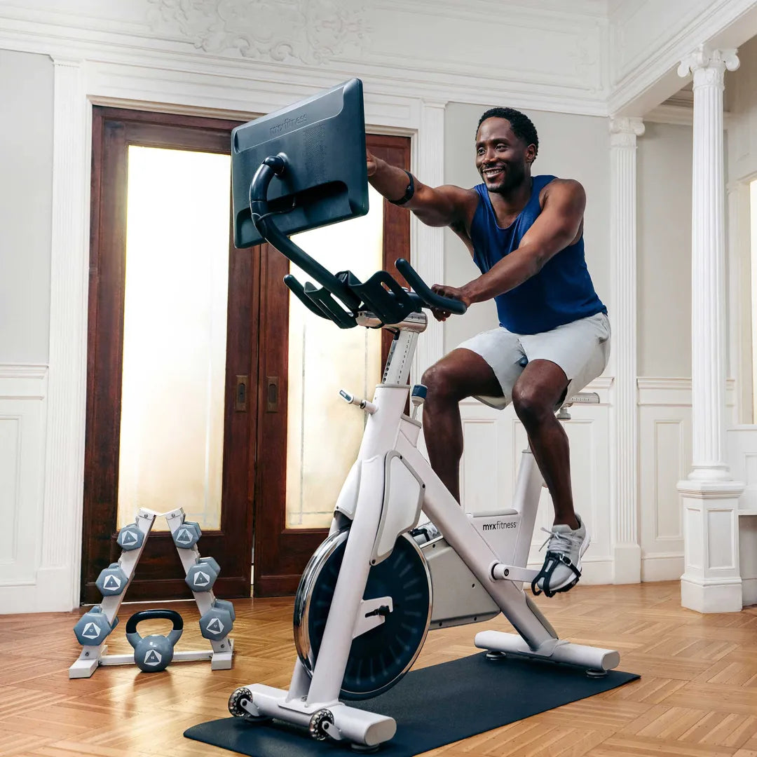 BODi Coach on their bike during a live workout